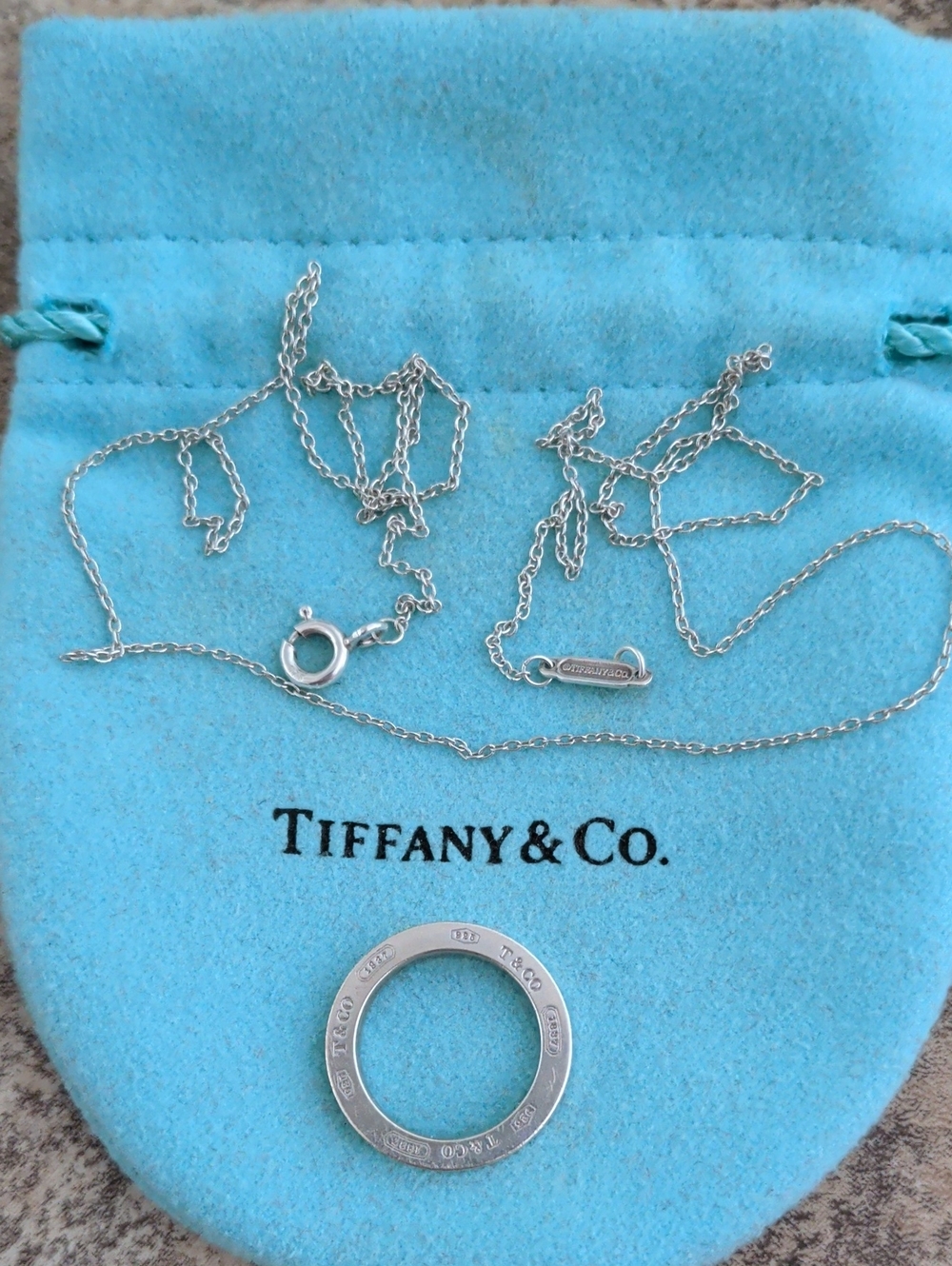 Tiffany & Co. Silver Round Pendant Necklace with Blue Pouch